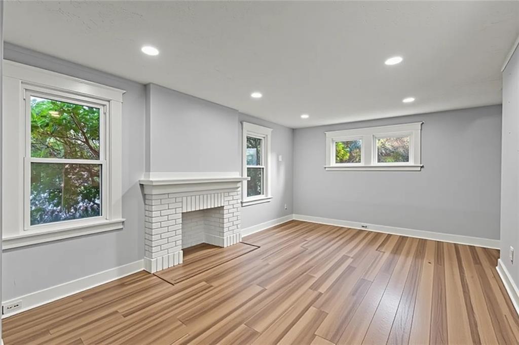 433 Green Street Homestead, PA 15120 - Photo 10 of 33 a view of empty room with wooden floor and fireplace