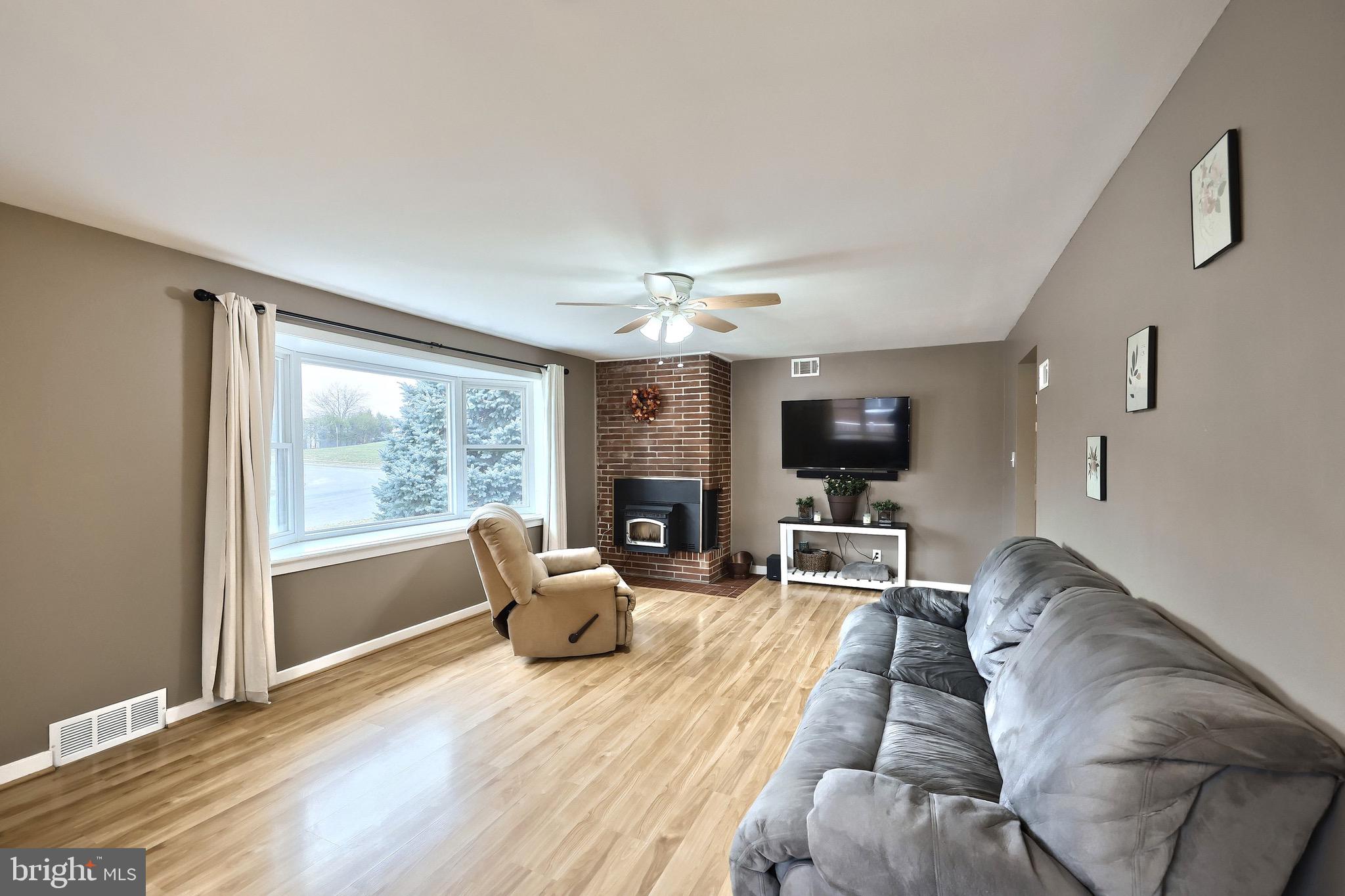 4619 South Road Harrisburg, PA 17109 - Photo 11 of 29 a living room with furniture fireplace and flat screen tv