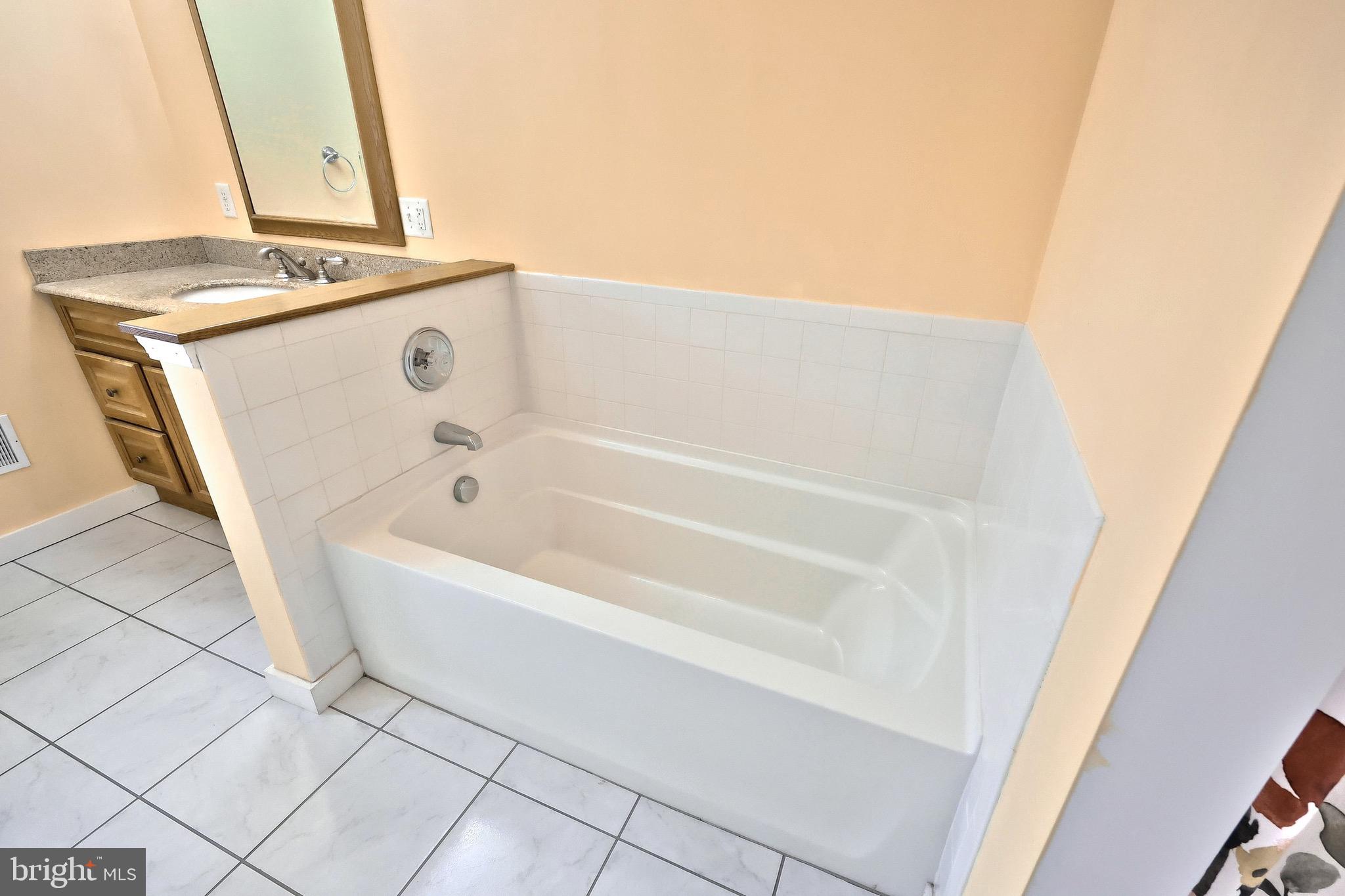 4619 South Road Harrisburg, PA 17109 - Photo 20 of 29 a bathroom with a bathtub