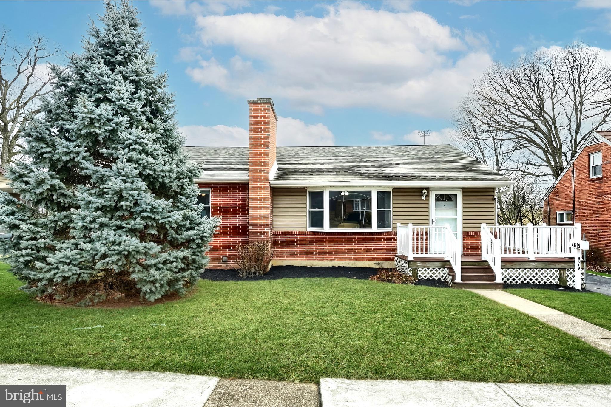 4619 South Road Harrisburg, PA 17109 - Photo 3 of 29 a front view of a house with a garden and yard