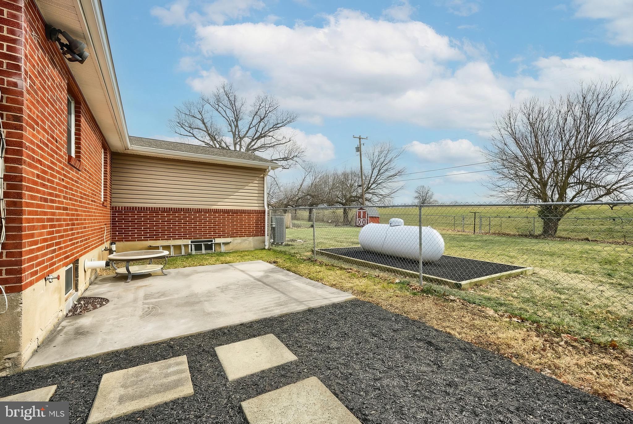 4619 South Road Harrisburg, PA 17109 - Photo 5 of 29 a backyard of a house with table and chairs