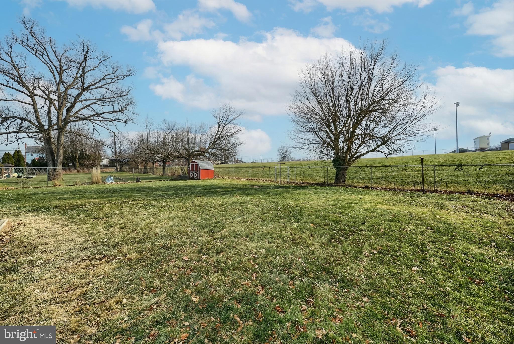 4619 South Road Harrisburg, PA 17109 - Photo 6 of 29 a view of a field with a tree