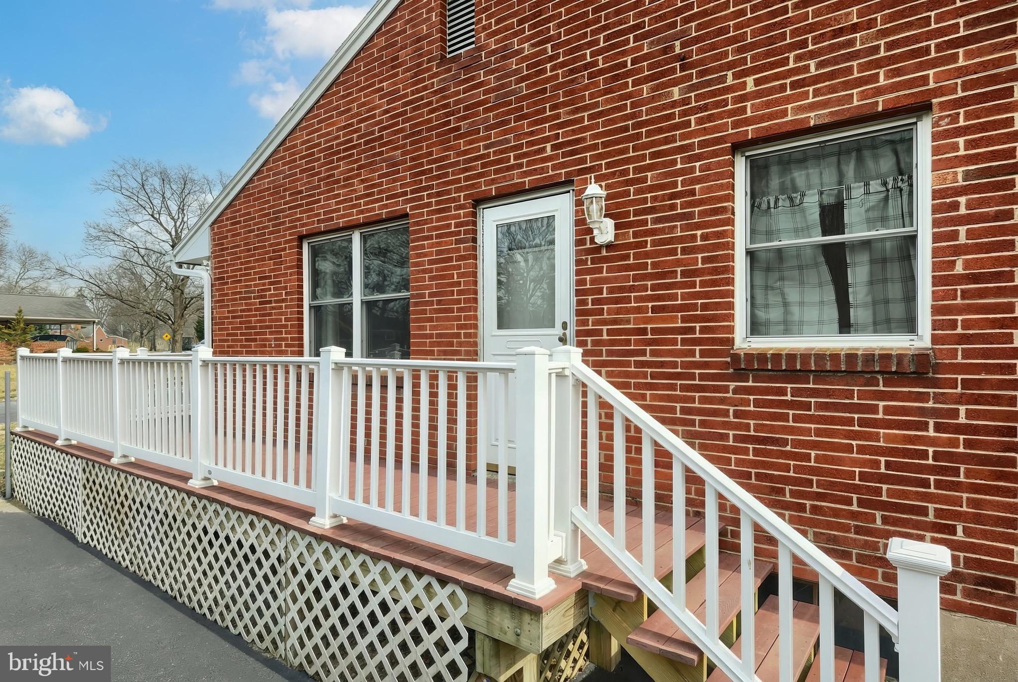 4619 South Road Harrisburg, PA 17109 - Photo 7 of 29 a view of a brick house with wooden fence