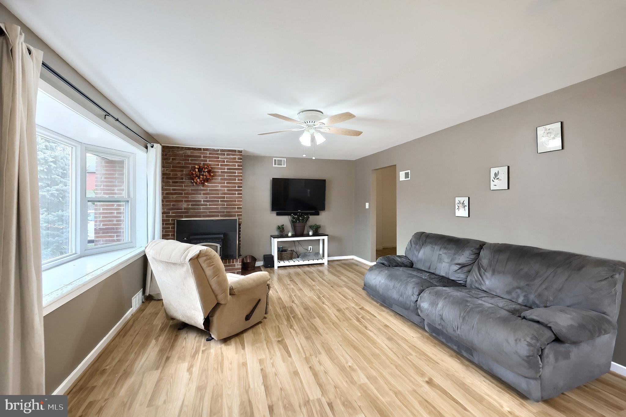 4619 South Road Harrisburg, PA 17109 - Photo 9 of 29 a living room with furniture and a flat screen tv