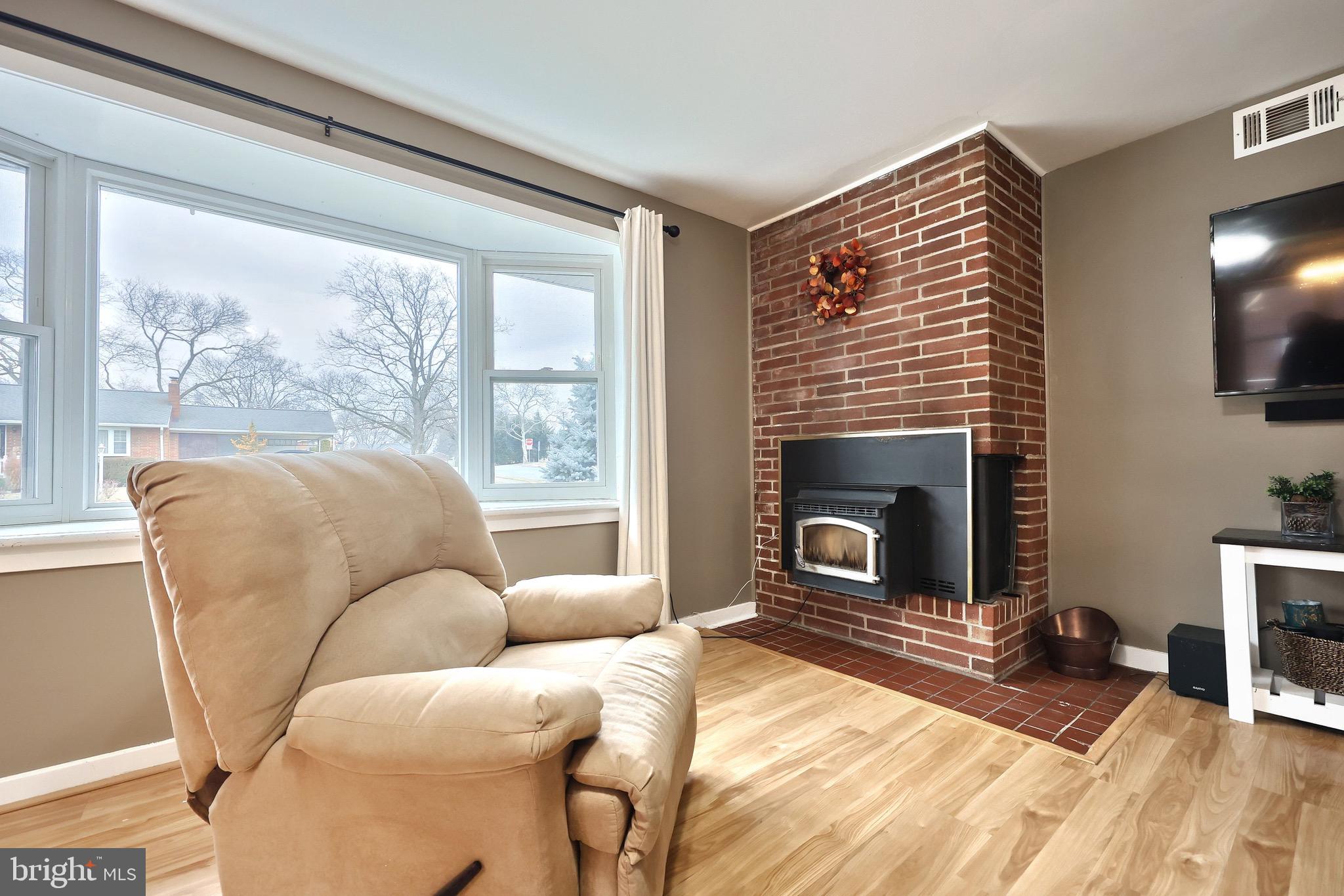 4619 South Road Harrisburg, PA 17109 - Photo 10 of 29 a bedroom with furniture and a fireplace