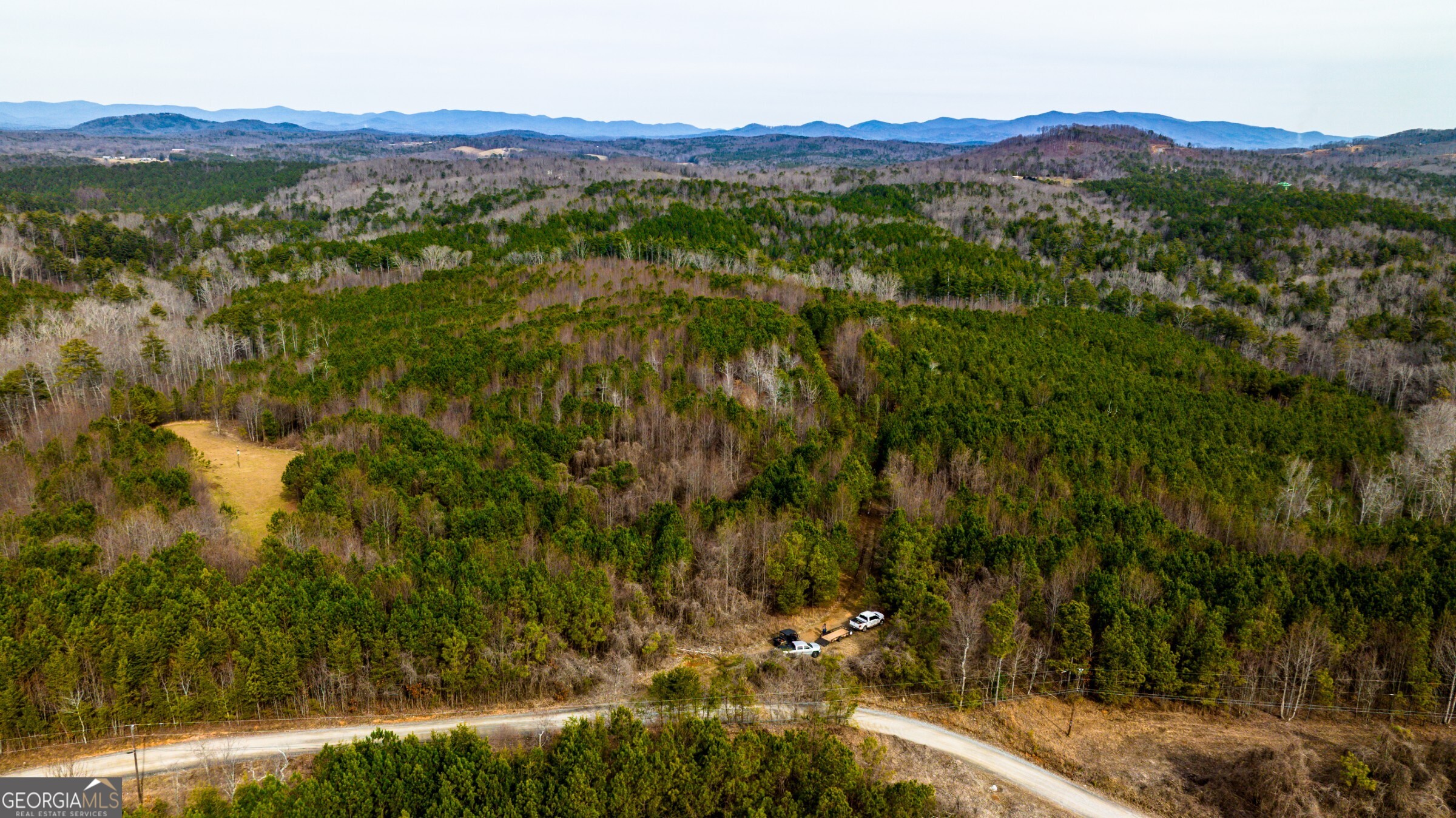 0 Trout Farm Road Talking Rock, GA 30175 - Photo 23 of 43 a view of a lush green hillside and houses