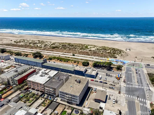 a aerial view of a house with a yard