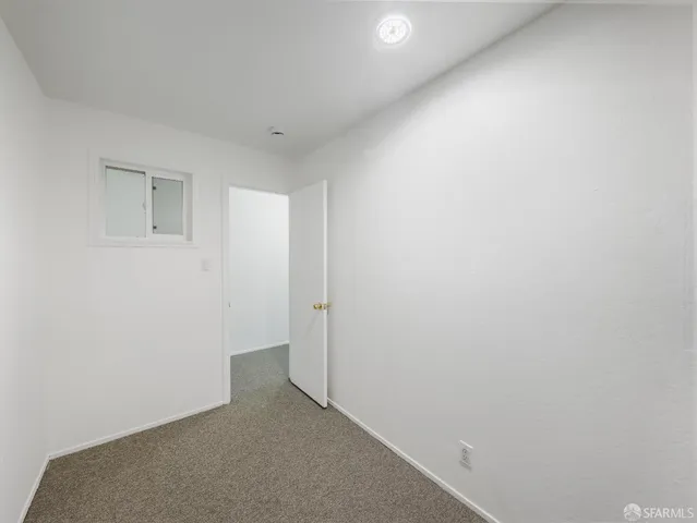 a view of a hallway with a room