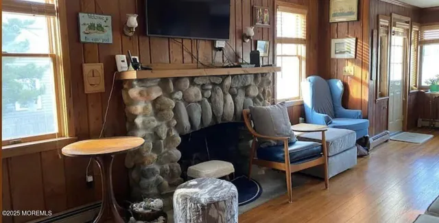 a view of a room with furniture and a window