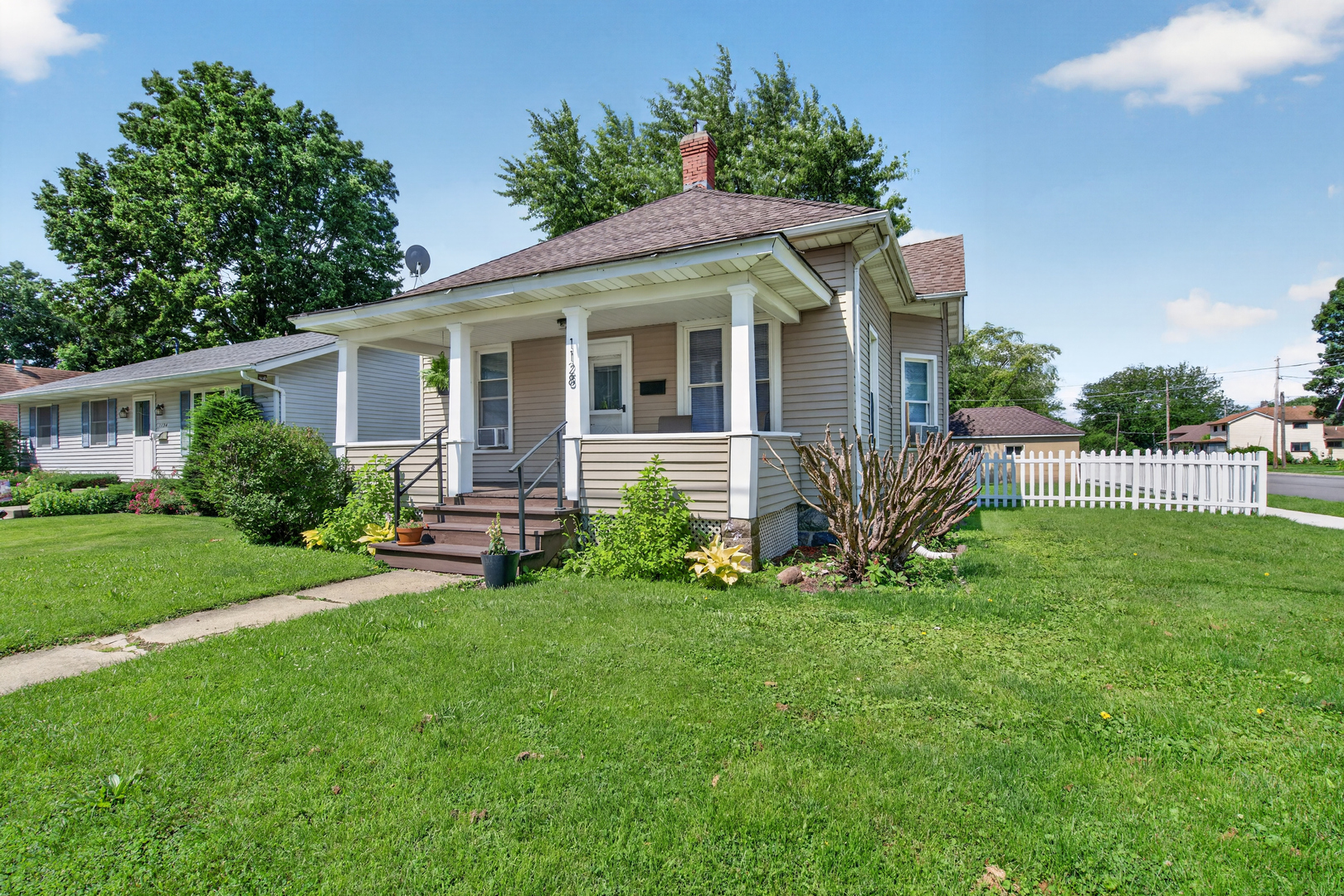 1128 Butler Street Morris, IL 60450 - Photo 1 of 28 a front view of house with yard and green space