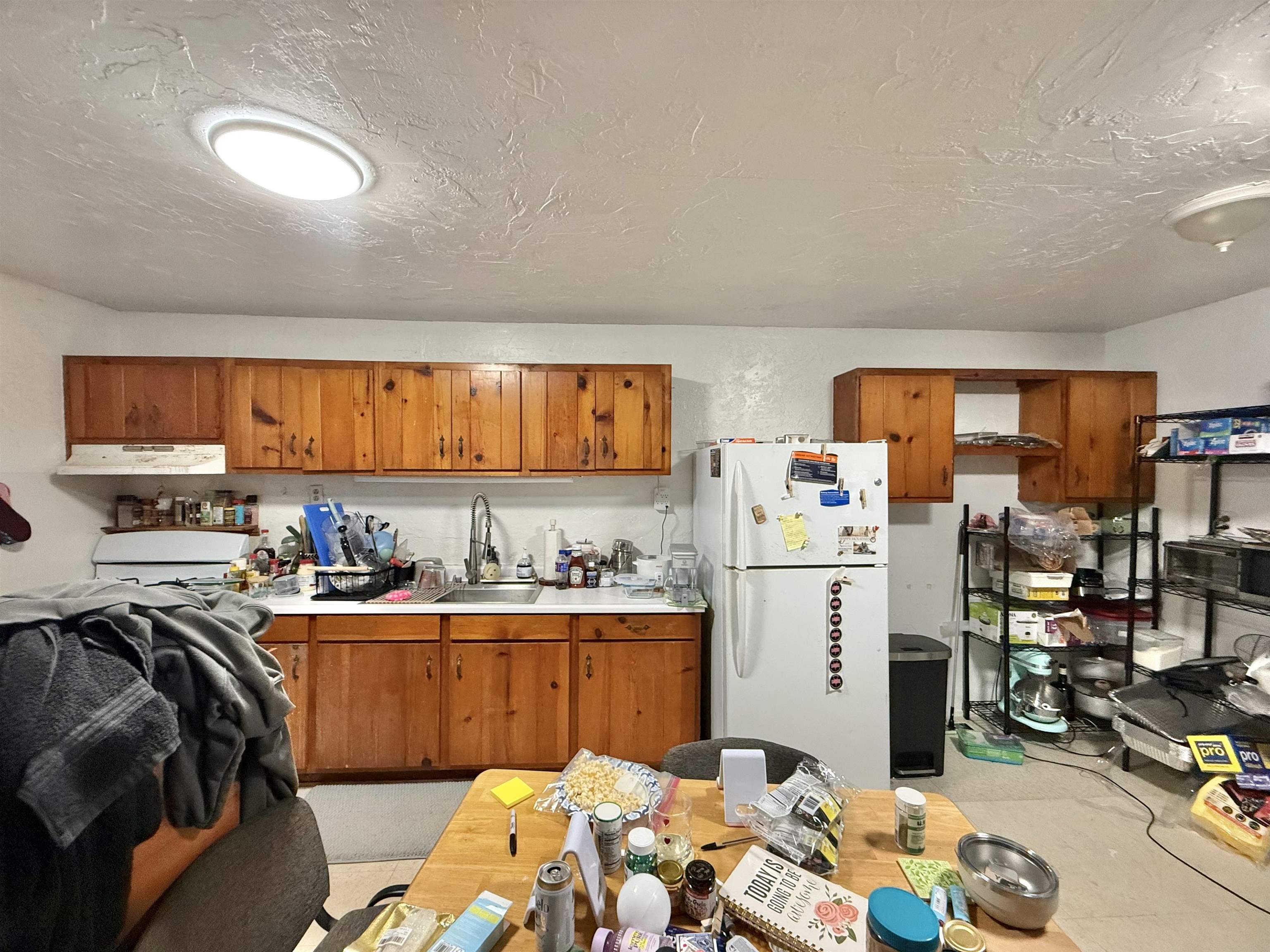 1630 Kauhikoa Road Haiku, HI 96708 - Photo 46 of 48 a kitchen with a sink appliances and cabinets
