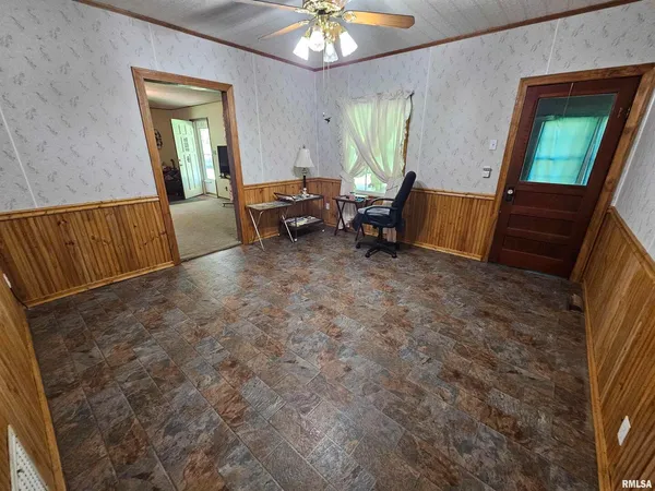 a view of a livingroom with furniture and a flat screen tv