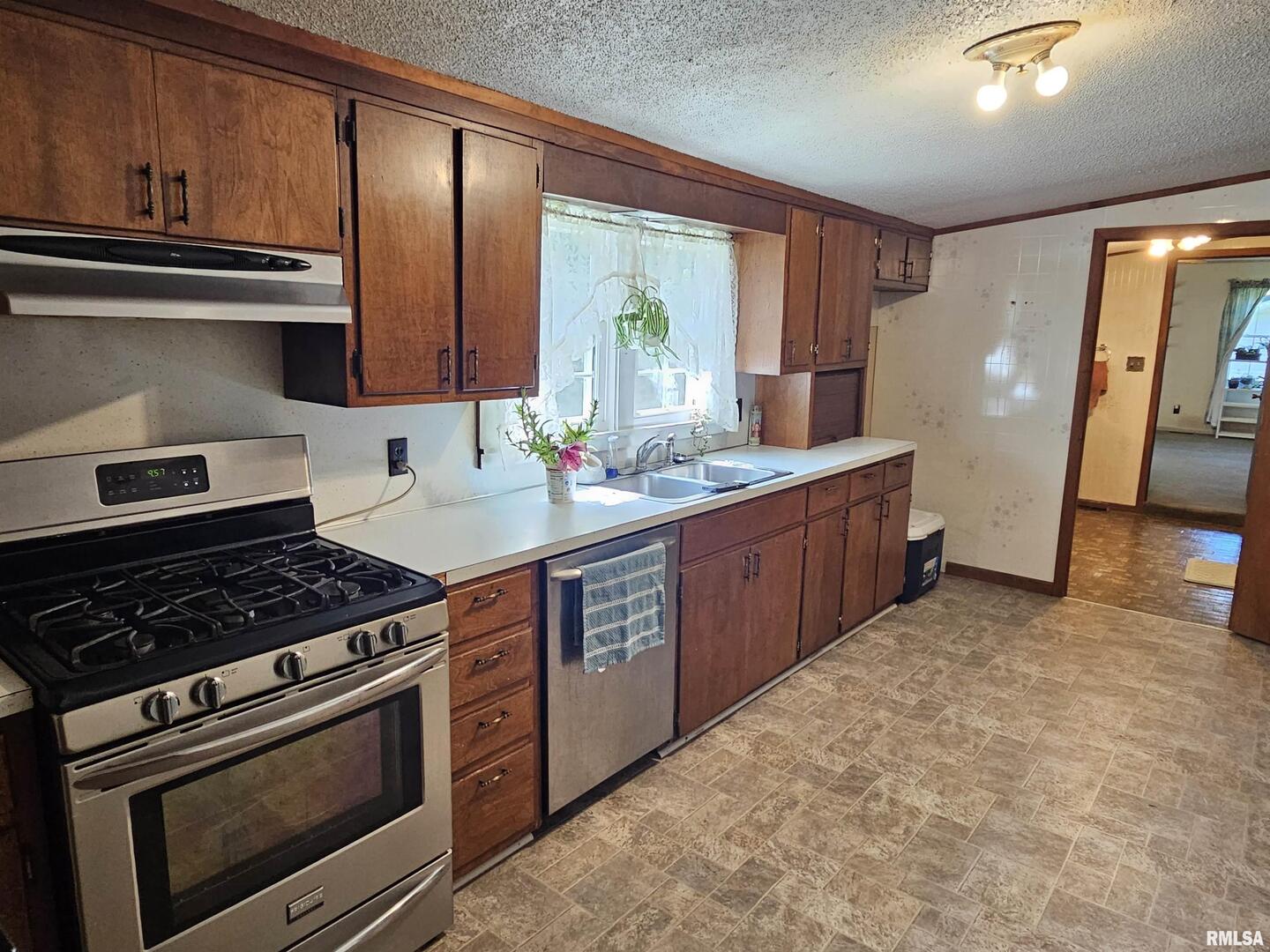 4864 Boaz Road Grand Chain, IL 62941 - Photo 16 of 32 a kitchen with stainless steel appliances granite countertop a stove a sink and a microwave