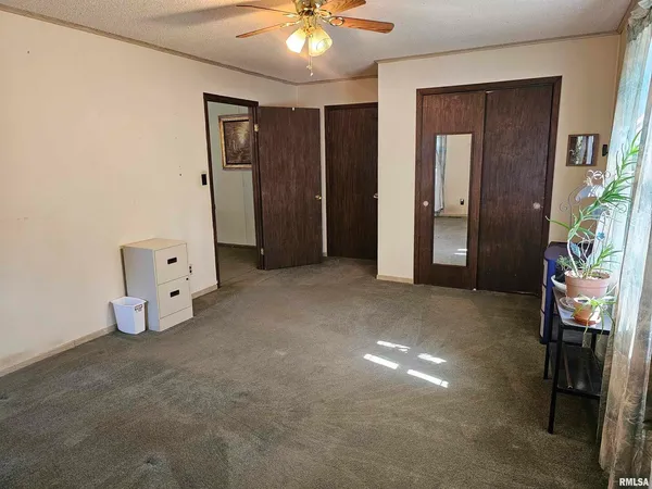 a view of an empty room with a bathroom