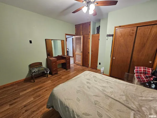 a bedroom with bed and window