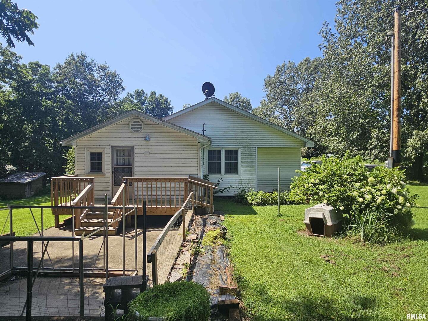4864 Boaz Road Grand Chain, IL 62941 - Photo 4 of 32 a view of a house with backyard and sitting area