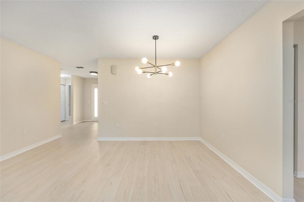 17549 Southeast 115th Terrace Road Summerfield, FL 34491 - Photo 16 of 56 a view of a room with a ceiling fan and a window