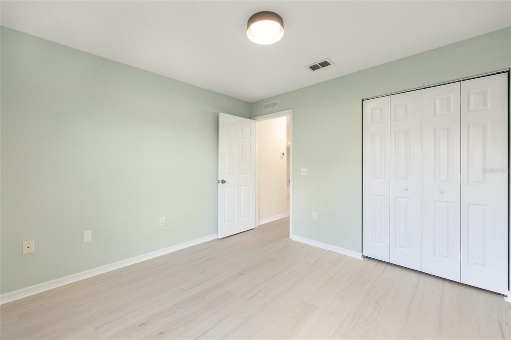 17549 Southeast 115th Terrace Road Summerfield, FL 34491 - Photo 35 of 56 wooden floor in an empty room