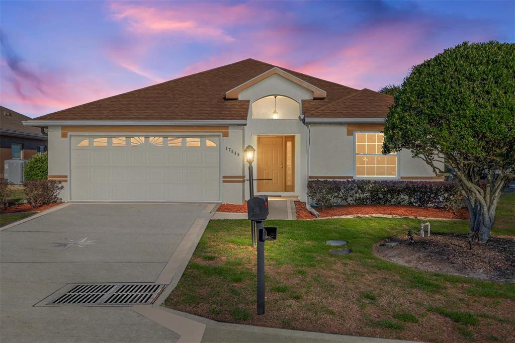 17549 Southeast 115th Terrace Road Summerfield, FL 34491 - Photo 44 of 56 a front view of a house with a yard