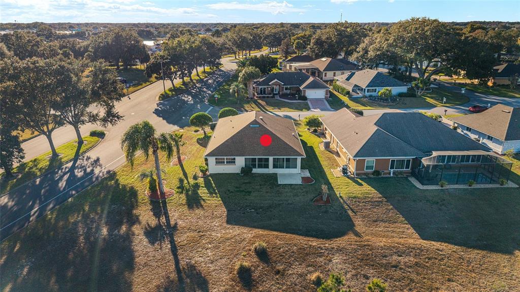 17549 Southeast 115th Terrace Road Summerfield, FL 34491 - Photo 49 of 56 an aerial view of residential houses with outdoor space and trees