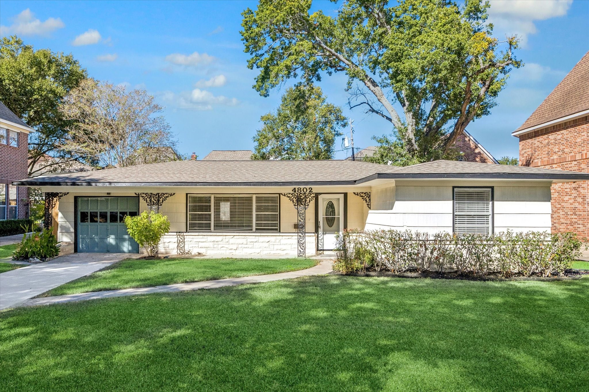 front view of a house with a yard