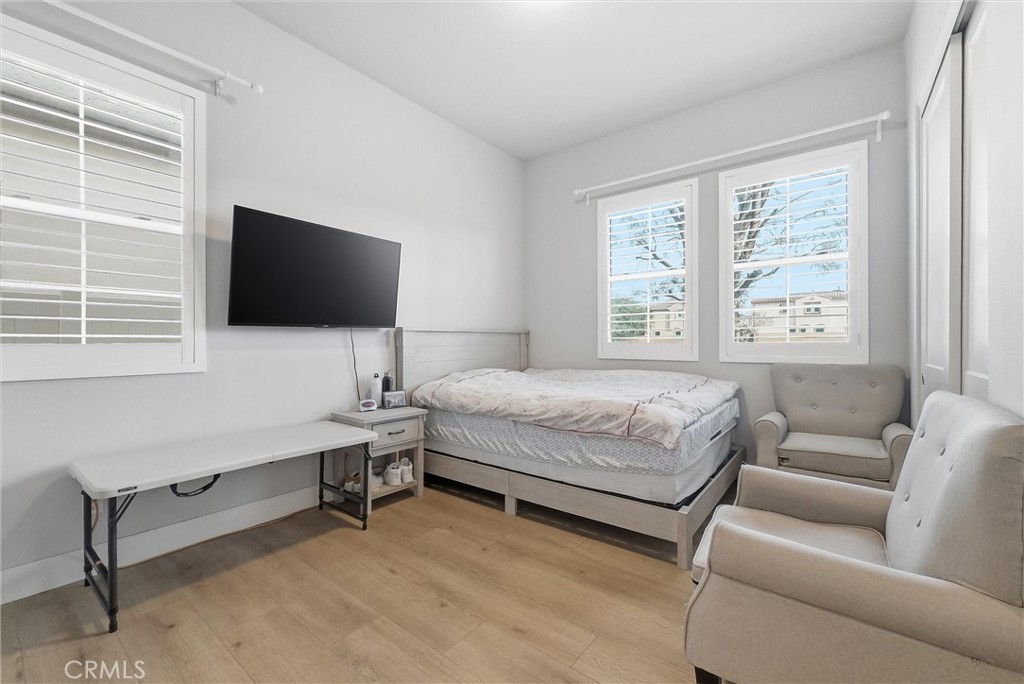 15828 Kingston Road Chino Hills, CA 91709 - Photo 11 of 28 a bedroom with a bed and a flat screen tv