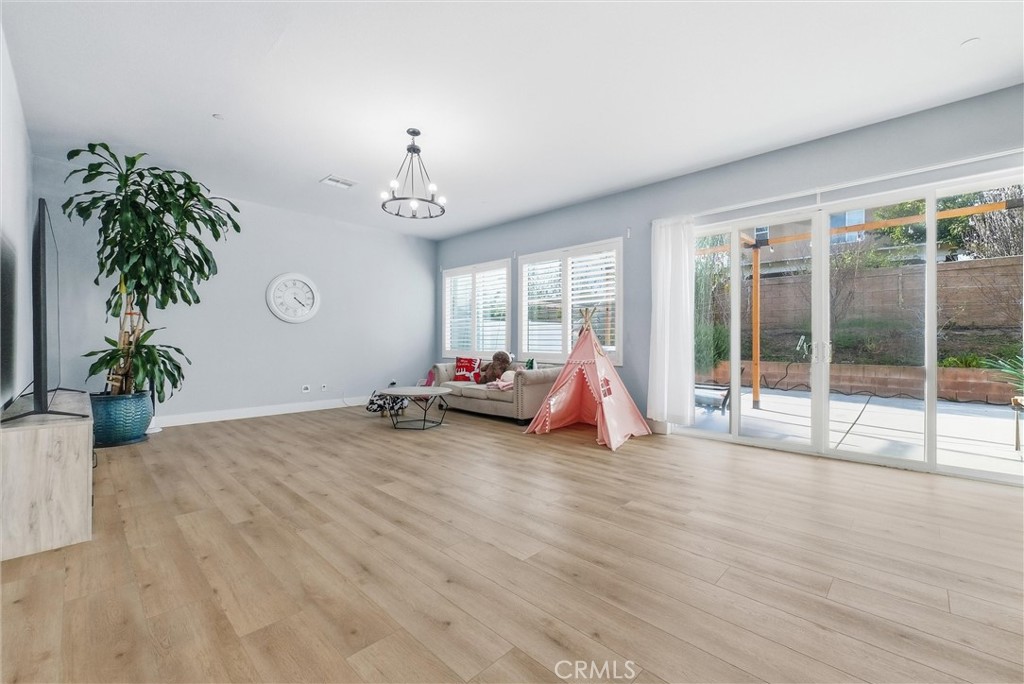 15828 Kingston Road Chino Hills, CA 91709 - Photo 4 of 28 a view of a room with gym equipment and a large window