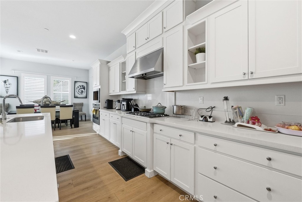 15828 Kingston Road Chino Hills, CA 91709 - Photo 6 of 28 a kitchen with stainless steel appliances granite countertop a refrigerator and cabinets
