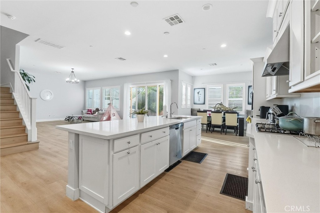 15828 Kingston Road Chino Hills, CA 91709 - Photo 7 of 28 a kitchen with sink stove and cabinets