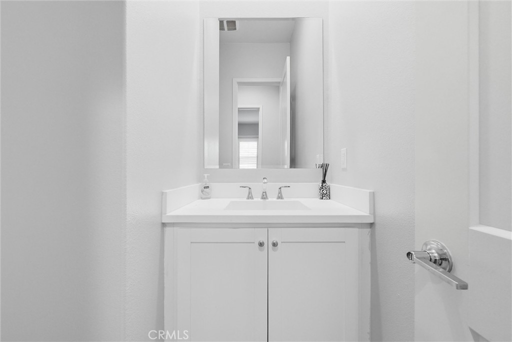 15828 Kingston Road Chino Hills, CA 91709 - Photo 10 of 28 a bathroom with a sink and a mirror