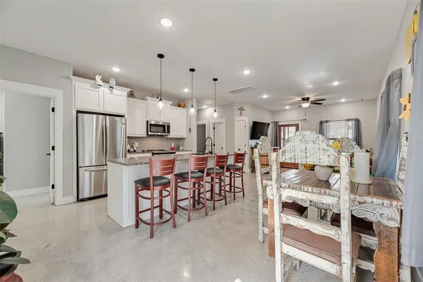a view of a dining room with furniture