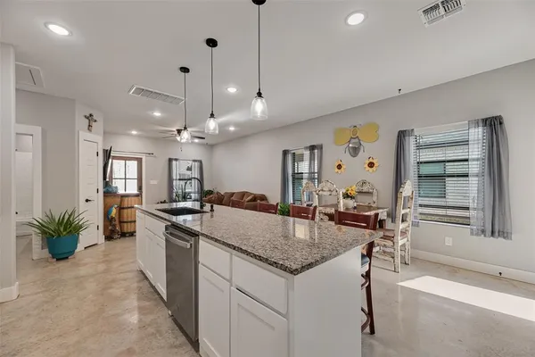 a kitchen with a sink and refrigerator