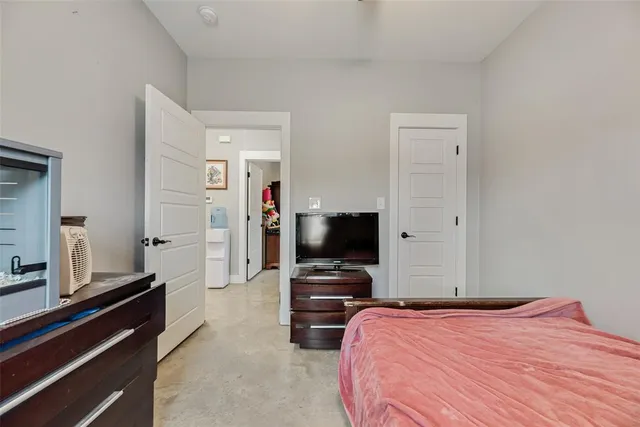 a bathroom with a granite countertop toilet a sink and a mirror