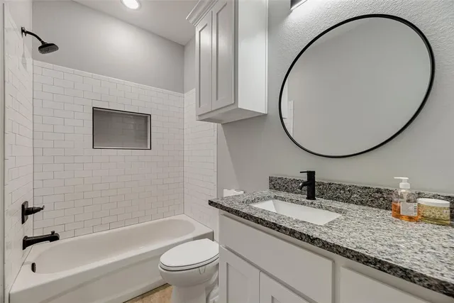 a bathroom with a sink a vanity and a mirror