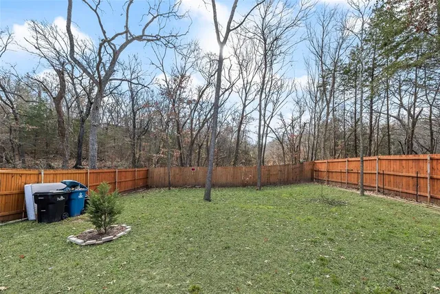 a view of backyard with green space