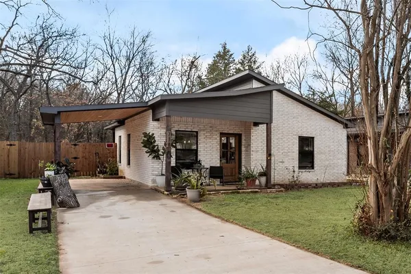 an aerial view of residential house with outdoor space