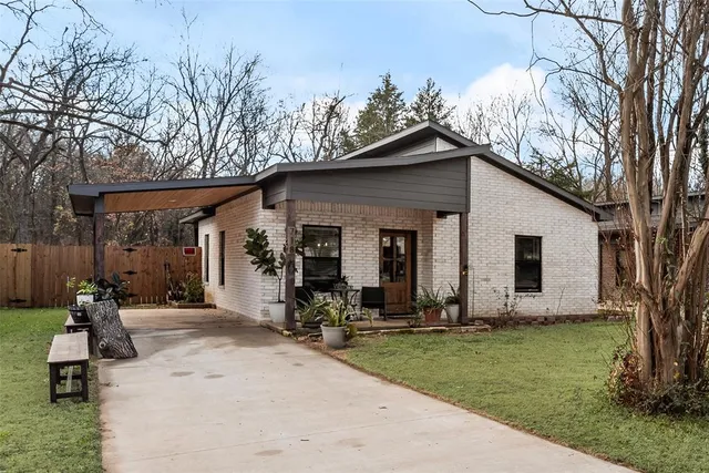 an aerial view of residential house with outdoor space