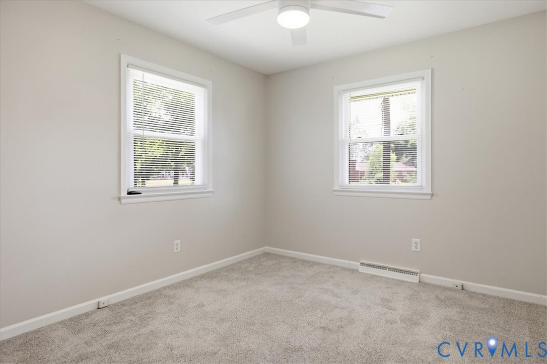 404 Bermuda Hundred Road Chester, VA 23836 - Photo 15 of 37 Neutral-toned room featuring a ceiling fan with in