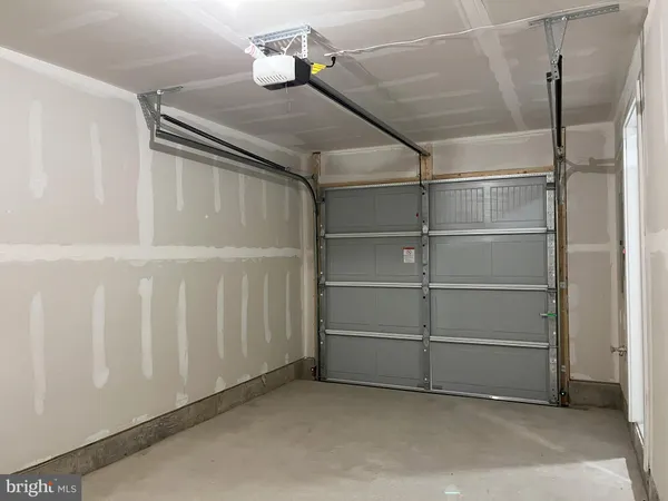 a front view of a house with garage