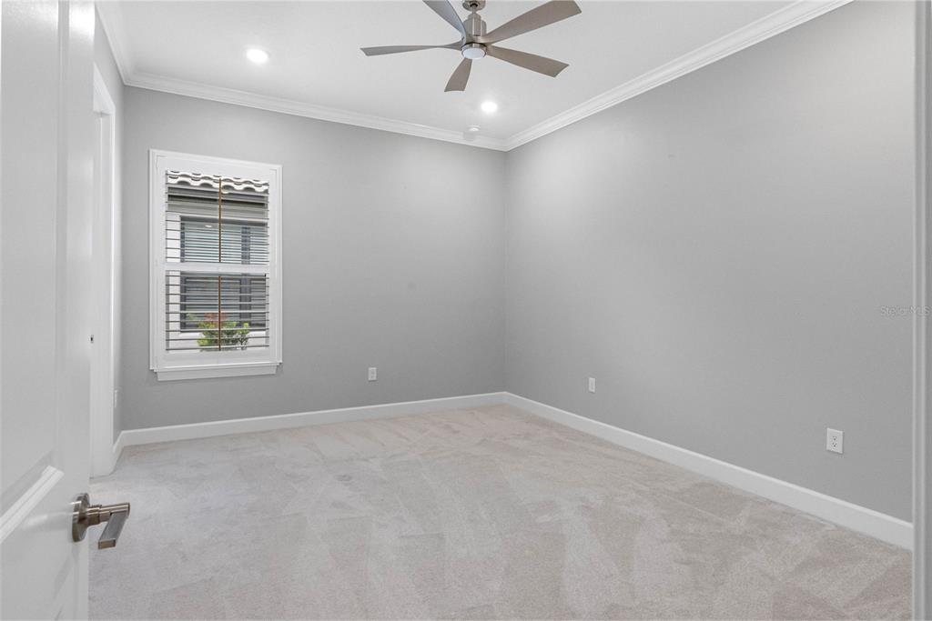 4795 Freccia Loop Wesley Chapel, FL 33543 - Photo 29 of 51 a view of an empty room with a window