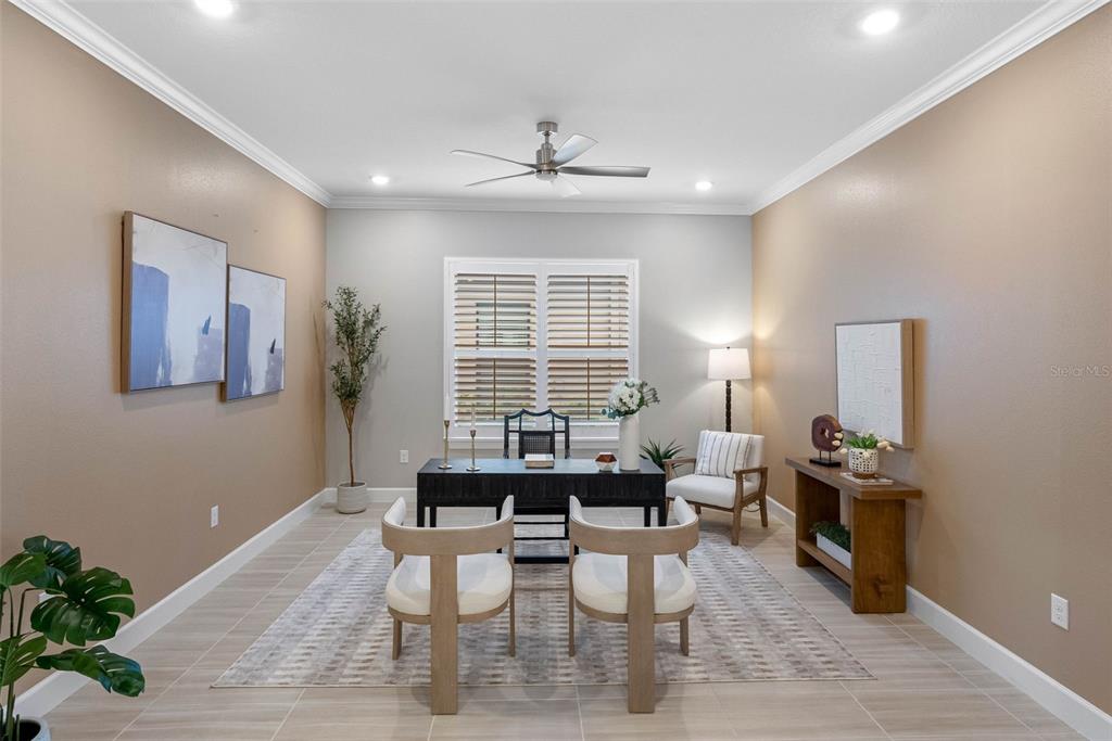 4795 Freccia Loop Wesley Chapel, FL 33543 - Photo 6 of 51 a dining room with wooden floor and a window