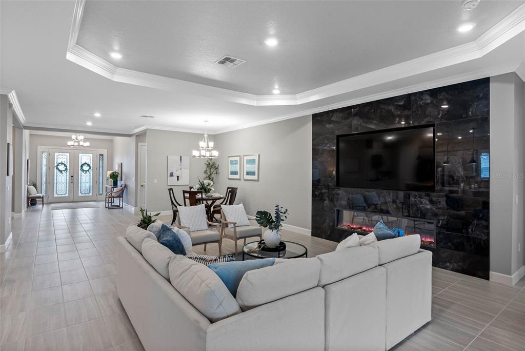 4795 Freccia Loop Wesley Chapel, FL 33543 - Photo 10 of 51 a living room with furniture and a flat screen tv