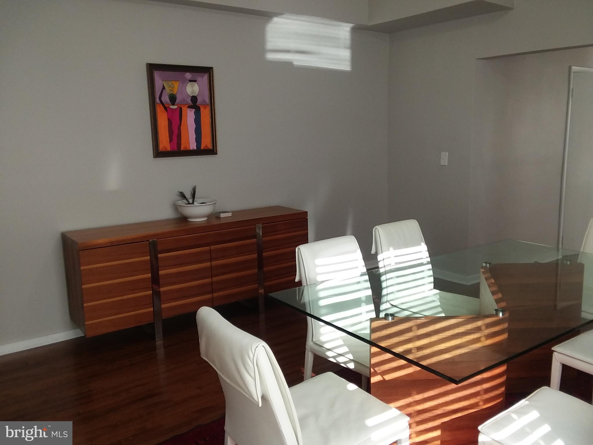 2012 Mt Royal Terrace, Unit 4 Baltimore, MD 21217 - Photo 16 of 55 a view of a room with furniture and wooden floor