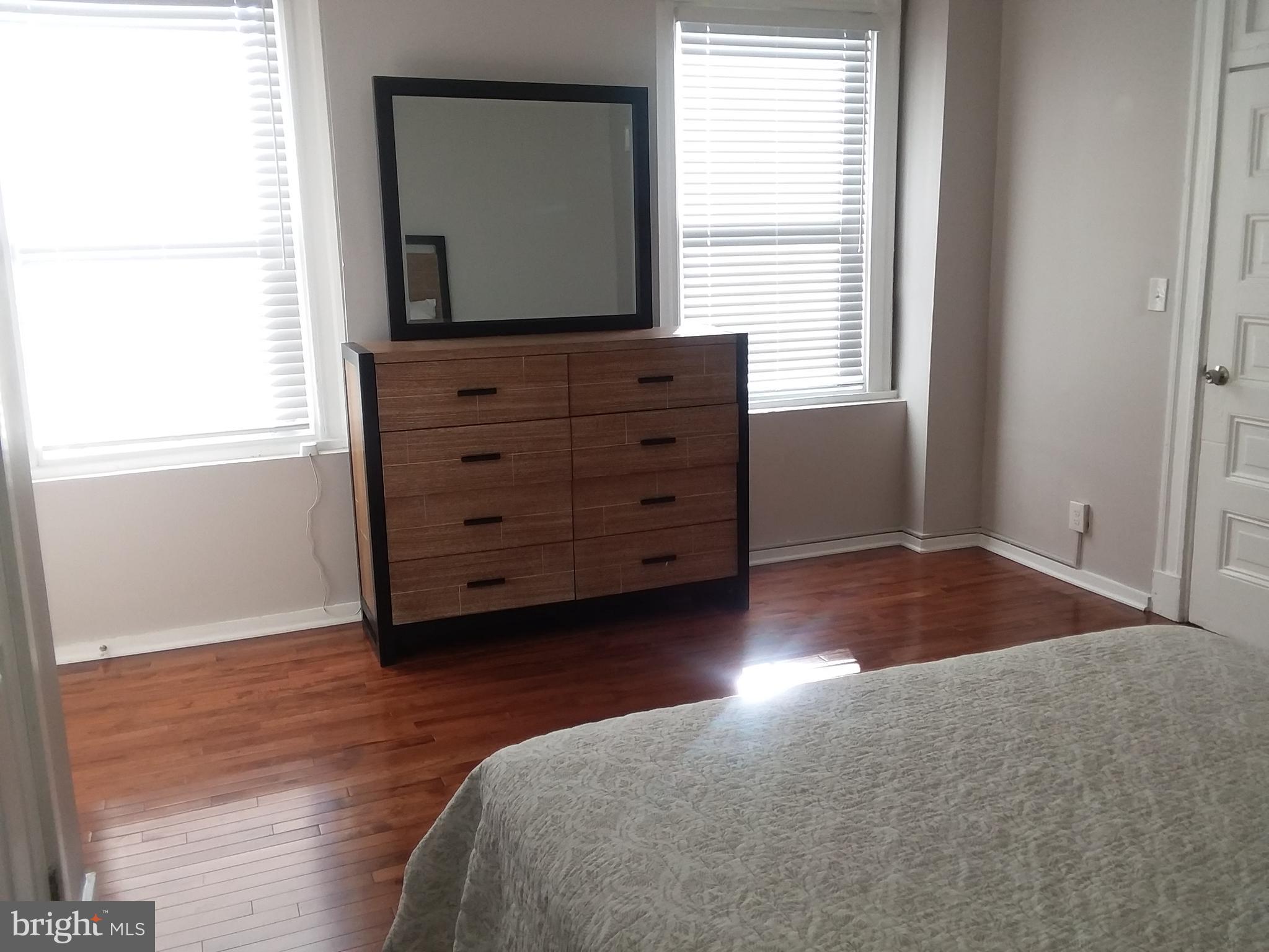 2012 Mt Royal Terrace, Unit 4 Baltimore, MD 21217 - Photo 18 of 55 a living room with hard wood floors and a window