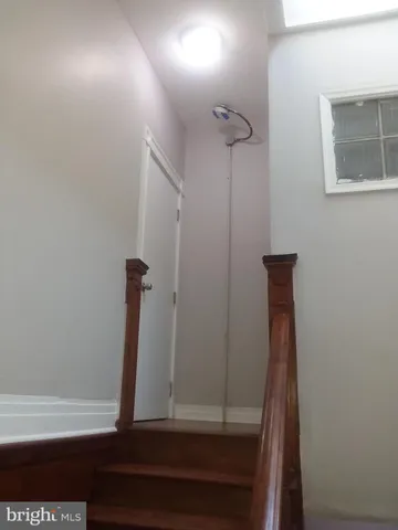 a street view with residential houses and trees