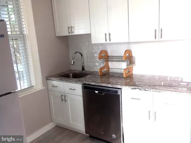 a room with furniture and wooden floor