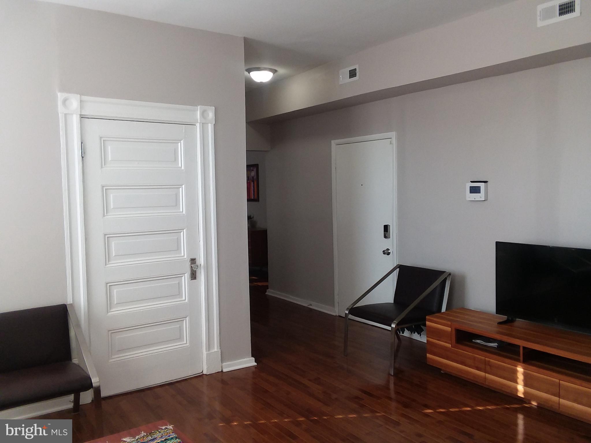 2012 Mt Royal Terrace, Unit 4 Baltimore, MD 21217 - Photo 10 of 55 a room with furniture and wooden floor