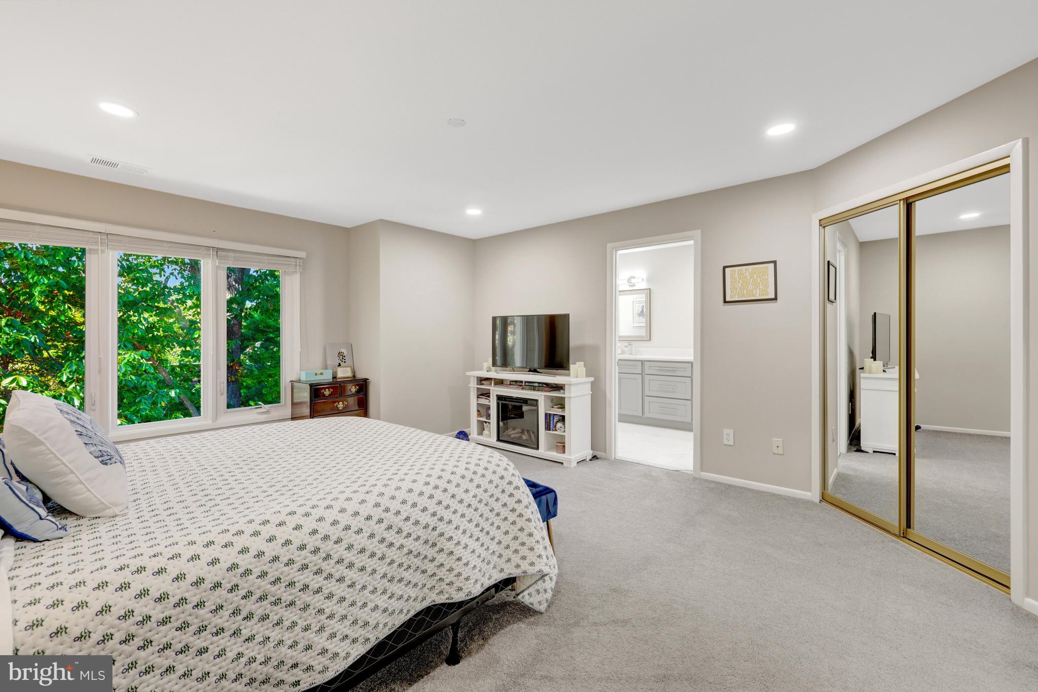 11110 Lakespray Way Reston, VA 20191 - Photo 27 of 60 The wall of windows provides views of the trees!