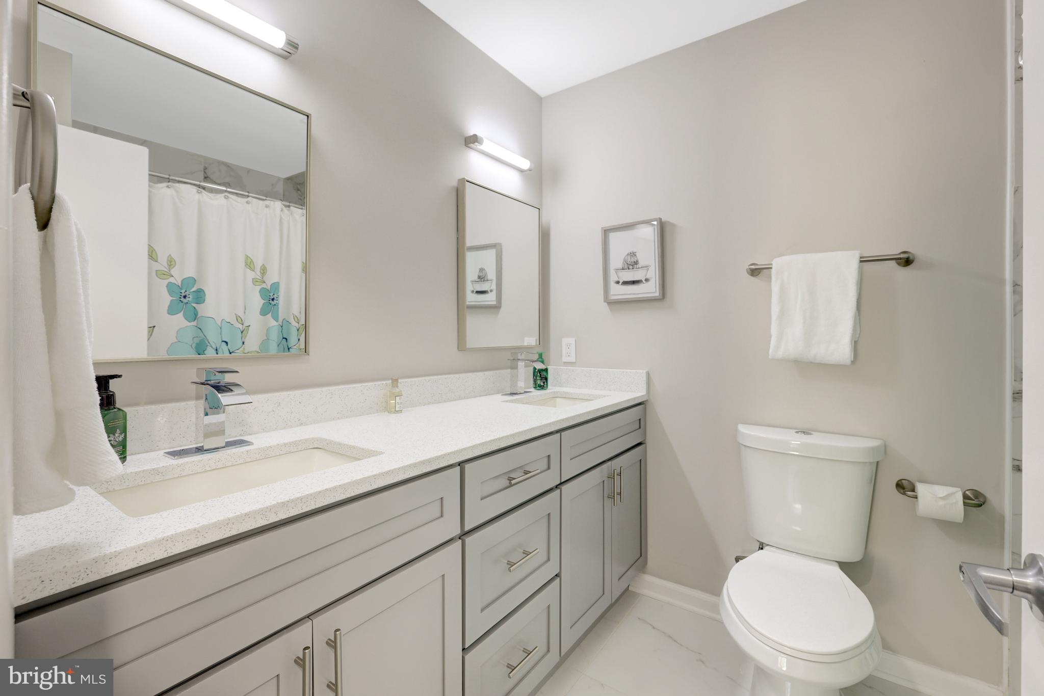 11110 Lakespray Way Reston, VA 20191 - Photo 35 of 60 Full hall bath with double sinks & quartz counter.