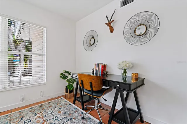a view of a dining room with furniture and window